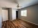 This bedroom offers attractive wood floors, a ceiling fan, a window, and a closet with sliding doors at 3412 Catherine Mermet Ave, North Las Vegas, NV 89081