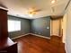 Bedroom with wood floors and ample natural light at 3412 Catherine Mermet Ave, North Las Vegas, NV 89081