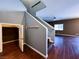 View of the entryway with hardwood floors, coat rack, a closet, and stairs leading to the second floor at 3412 Catherine Mermet Ave, North Las Vegas, NV 89081