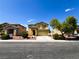 Two story home with a landscaped front yard, driveway, and two car garage at 3412 Catherine Mermet Ave, North Las Vegas, NV 89081