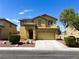 Two story home with solar panels, landscaped front yard, and an attached garage at 3412 Catherine Mermet Ave, North Las Vegas, NV 89081