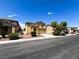View of a two-story house with a landscaped front yard with driveway and garage at 3412 Catherine Mermet Ave, North Las Vegas, NV 89081