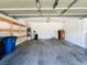 Spacious garage with storage shelves, door to interior, and water conditioning at 3412 Catherine Mermet Ave, North Las Vegas, NV 89081