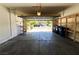 Spacious garage with storage shelves, door to interior, and room for parking at 3412 Catherine Mermet Ave, North Las Vegas, NV 89081