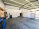 Spacious garage with storage shelves, door to interior, and water conditioning at 3412 Catherine Mermet Ave, North Las Vegas, NV 89081