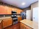 Spacious kitchen featuring stainless steel appliances and wooden cabinets at 3412 Catherine Mermet Ave, North Las Vegas, NV 89081