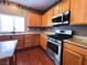 Kitchen featuring stainless steel appliances and a double sink beneath the window at 3412 Catherine Mermet Ave, North Las Vegas, NV 89081