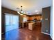 Kitchen features wood floors, island and stainless steel appliances at 3412 Catherine Mermet Ave, North Las Vegas, NV 89081