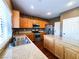 Kitchen with wood cabinets, stainless steel appliances, and stone countertops at 3412 Catherine Mermet Ave, North Las Vegas, NV 89081