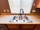Stainless steel kitchen sink with double basin and granite countertops at 3412 Catherine Mermet Ave, North Las Vegas, NV 89081