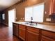 Bright kitchen sink with stainless steel features and a granite countertop by a window at 3412 Catherine Mermet Ave, North Las Vegas, NV 89081