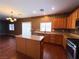 Bright kitchen with an island, stainless appliances, and wood floors at 3412 Catherine Mermet Ave, North Las Vegas, NV 89081