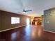 Open floor plan features hardwood floors, large windows and adjoins the kitchen at 3412 Catherine Mermet Ave, North Las Vegas, NV 89081