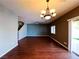 View of the living room featuring hardwood floors, a sliding glass door to the back, and a chandelier at 3412 Catherine Mermet Ave, North Las Vegas, NV 89081