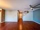 View of living room features wood floors, neutral paint and staircase at 3412 Catherine Mermet Ave, North Las Vegas, NV 89081