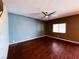 Spacious living room with ceiling fan, hardwood floors, and a window with natural light at 3412 Catherine Mermet Ave, North Las Vegas, NV 89081