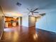 View of the living room and kitchen features hardwood floors and neutral colors at 3412 Catherine Mermet Ave, North Las Vegas, NV 89081