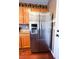 Stainless steel refrigerator with a water dispenser next to a white door at 3412 Catherine Mermet Ave, North Las Vegas, NV 89081