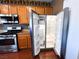 Stainless steel refrigerator with double doors and a water dispenser at 3412 Catherine Mermet Ave, North Las Vegas, NV 89081