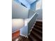 Spacious staircase with modern design, hardwood steps and natural light from upper windows at 3412 Catherine Mermet Ave, North Las Vegas, NV 89081