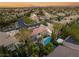 A beautiful shot showing homes in a neighborhood with pools and lush greenery at 3535 Coventry Gardens Dr, Las Vegas, NV 89135