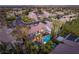 An aerial view of a community with pools and palm trees at 3535 Coventry Gardens Dr, Las Vegas, NV 89135