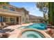 Spacious backyard with pool, spa, and patio seating area at 3535 Coventry Gardens Dr, Las Vegas, NV 89135