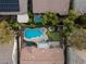 Aerial view of a private backyard with a sparkling pool, spa, and putting green at 3535 Coventry Gardens Dr, Las Vegas, NV 89135