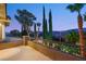 Dusk angle view from balcony featuring mature landscaping and mountain scenery at 3535 Coventry Gardens Dr, Las Vegas, NV 89135