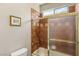 Bathroom features a shower with a glass enclosure and tiled walls at 3535 Coventry Gardens Dr, Las Vegas, NV 89135