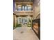 Inviting courtyard with fireplace, tiled patio, and view to the interior living space at 3535 Coventry Gardens Dr, Las Vegas, NV 89135