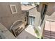 Overhead view of the private courtyard featuring an outdoor fireplace and string lights at 3535 Coventry Gardens Dr, Las Vegas, NV 89135