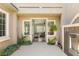 Inviting home entrance featuring a waterfall, lush greenery, and a glimpse into the living room at 3535 Coventry Gardens Dr, Las Vegas, NV 89135