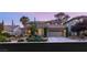 Charming two-story home with a landscaped front yard and a two-car garage at 3535 Coventry Gardens Dr, Las Vegas, NV 89135