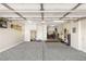 Spacious garage with storage cabinets and ample room for vehicles and organization at 3535 Coventry Gardens Dr, Las Vegas, NV 89135