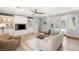 Inviting living room with custom built-ins, ceiling fan, and neutral tones at 3535 Coventry Gardens Dr, Las Vegas, NV 89135
