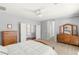 Bright main bedroom featuring balcony access, an en suite bathroom, and a ceiling fan at 3535 Coventry Gardens Dr, Las Vegas, NV 89135