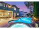 Backyard pool and spa with patio, chairs, and lush landscaping offer a perfect relaxation spot at twilight at 3535 Coventry Gardens Dr, Las Vegas, NV 89135