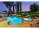 Inviting backyard pool with a spa, mature landscaping, and a serene atmosphere at 3535 Coventry Gardens Dr, Las Vegas, NV 89135