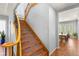 Elegant staircase featuring decorative tile risers, wooden banister and staircase open to dining area at 3535 Coventry Gardens Dr, Las Vegas, NV 89135