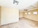 A spacious bedroom featuring a ceiling fan and multiple windows allowing for plenty of natural light at 3542 Harbor Tides St, Las Vegas, NV 89147