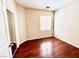 Bright bedroom with laminate floors, sliding closet doors, and lots of natural light at 3542 Harbor Tides St, Las Vegas, NV 89147