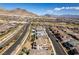 Stunning aerial view of a well-planned community with beautiful homes, roads, and scenic mountain backdrop at 365 Malpaso St, Las Vegas, NV 89138