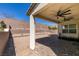 Backyard featuring a covered patio and low-maintenance desert landscaping at 365 Malpaso St, Las Vegas, NV 89138