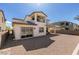 Spacious backyard featuring low-maintenance landscaping and a covered patio, perfect for outdoor entertaining at 365 Malpaso St, Las Vegas, NV 89138