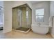 Luxurious bathroom featuring a glass-enclosed shower, modern soaking tub, and elegant fixtures at 365 Malpaso St, Las Vegas, NV 89138