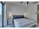 Bright bedroom with a comfortable bed, stylish decor, and sliding glass doors to a private balcony at 365 Malpaso St, Las Vegas, NV 89138