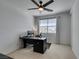 Cozy bedroom featuring a workspace with a sleek black desk and chair at 365 Malpaso St, Las Vegas, NV 89138