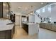 A spacious kitchen showcases a large island with bar seating, stylish pendants, and stainless appliances at 365 Malpaso St, Las Vegas, NV 89138