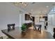 The kitchen offers great space, dark cabinets, large island and stainless appliances, creating a modern space at 365 Malpaso St, Las Vegas, NV 89138